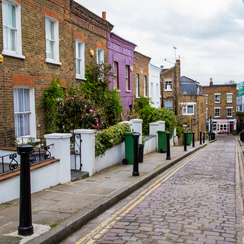 London street of typical small 19th century Victorian terraced houses, without parked cars